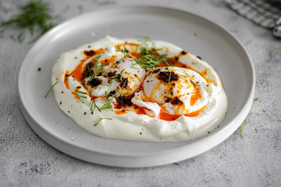 Turkish eggs with yoghurt, chilli oil and fresh dill