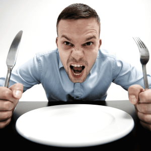 Man sits angrily waiting for his food