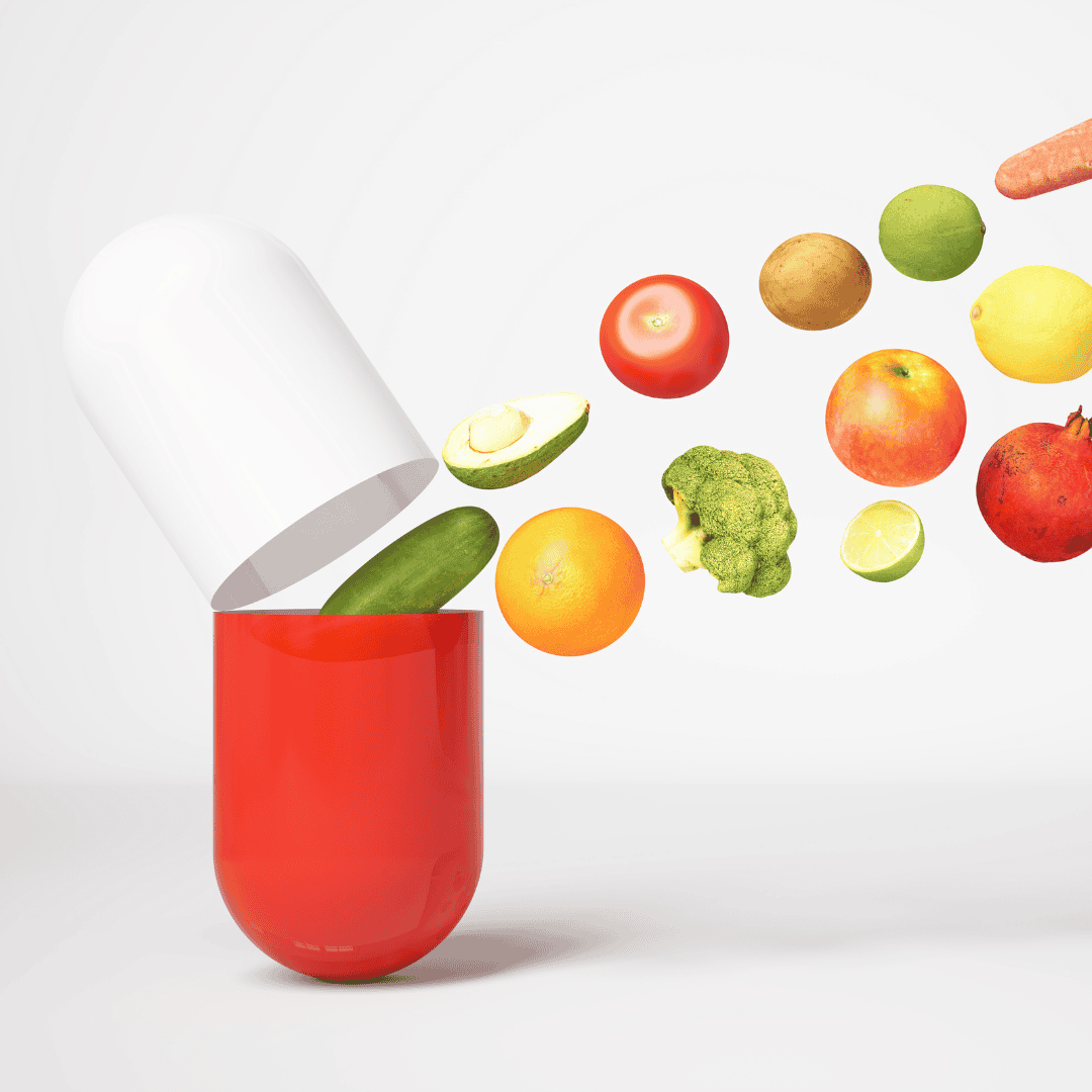 A large red and white multivitamin capsule opened, with various fruits and vegetables like avocado, tomato, broccoli, and orange emerging from it, symbolizing the nutrients found in whole foods.